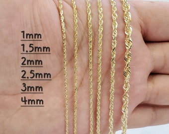 May include: A close-up of six gold rope chains of different thicknesses, laid out on a hand. The chains are labeled with their thickness in millimeters: 1mm, 1.5mm, 2mm, 2.5mm, 3mm, and 4mm.