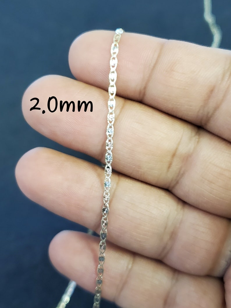 May include: A gold chain necklace with a 2.0mm width. The chain is made of small, oval-shaped links.