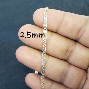 May include: A gold chain necklace with a 2.5mm width. The chain has a diamond-cut design.