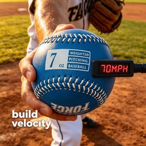 May include: A blue weighted baseball with white stitching and the text "7 OZ BASEBALL". A digital display shows "70MPH". The text "build velocity" is also visible. The baseball is held by a person on a baseball field.