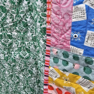 May include: A patchwork quilt with a variety of fabrics and patterns, including green floral, pink, blue, and yellow. The quilt features a calendar design with the months of June, July, and December.