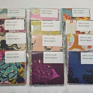 May include: A collection of fabric squares, each measuring 3.5 inches, packaged in clear plastic. The squares feature various colorful patterns, including floral, octopus, and geometric designs. Each package contains 42 pieces and is labeled "Mystery Squares."
