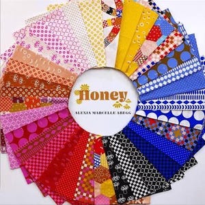 May include: A circular arrangement of fabric swatches in various colors and patterns, including polka dots, checks, and floral designs. The center features a white circle with the word "Honey" and the name "Alexia Marcelle Abegg".