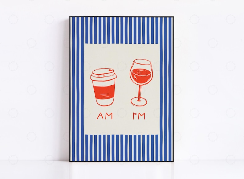 May include: A framed art print featuring a red coffee cup and a wine glass, with the text "AM" and "PM" below. The artwork has a cream-colored background with a blue and white striped border. The print is in a black frame.