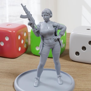 May include: A gray painted figurine of a person holding a rifle, standing on a gray circular base. The person is wearing a jacket, shorts, and headphones. The figurine is surrounded by four dice in different colors.