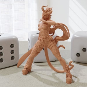 May include: A brown, 3D printed figurine of a female character with horns, a long tail, and long hair. The figurine is posed in a dynamic stance with one leg forward and one arm raised. The figurine is standing on a table with two white dice.