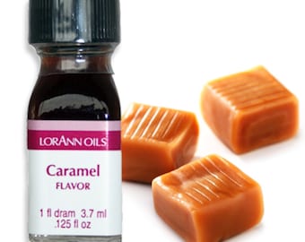 May include: A small glass bottle of caramel flavoring with a black cap, and a label that reads "Caramel Flavor". Three caramel candies are next to the bottle. The bottle contains 1 fl dram, or .125 fl oz.