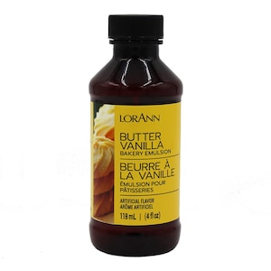 May include: A brown glass bottle of Lorann's Butter Vanilla Bakery Emulsion. The bottle has a yellow label with the product name and description in both English and French. The label also includes the size of the bottle, 118 ml (4 fl oz).