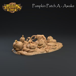 May include: A 3D printed miniature of a pumpkin patch with several pumpkins, some with carved faces, and vines. The pumpkins are a light brown colour and the vines are a darker brown. The text "Pumpkin Patch A - Awake" is visible in the background.
