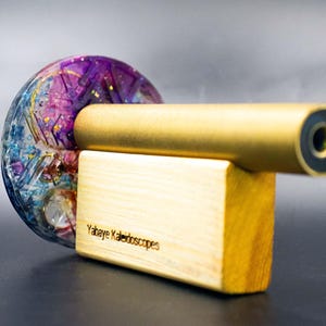 Mindfulness tool and visual aid: Brass kaleidoscope for meditation and deep relaxation. Generates captivating, symmetrical light patterns for mental focus and stress relief.