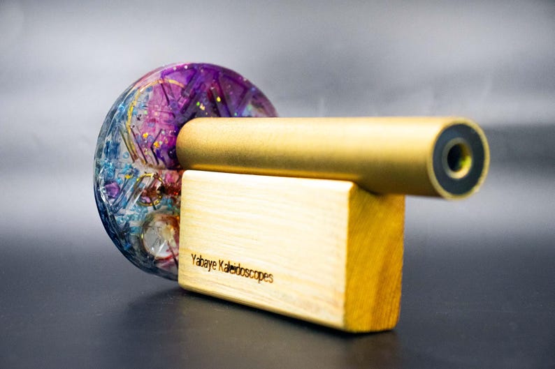 Mindfulness tool and visual aid: Brass kaleidoscope for meditation and deep relaxation. Generates captivating, symmetrical light patterns for mental focus and stress relief.
