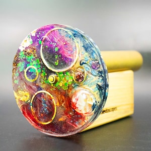 Solid, high-grade brass and colorful epoxy resin art object. A durable, elliptical kaleidoscope designed and crafted by an international artist.