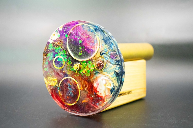 Solid, high-grade brass and colorful epoxy resin art object. A durable, elliptical kaleidoscope designed and crafted by an international artist.