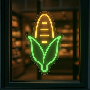 Può includere: Un'insegna al neon in una finestra raffigura una pannocchia di mais stilizzata. Il mais è delineato in giallo brillante, con quattro linee orizzontali che indicano i chicchi. Le foglie sono delineate in verde. L'insegna è probabilmente per un ristorante o un mercato.