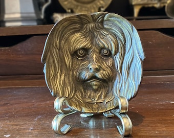 Cenicero/plato de bronce antiguo con forma de cara de perro