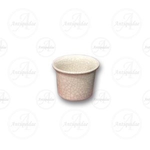 May include: A small, white ceramic planter with a crackled glaze. The planter is round and has a slightly flared lip.