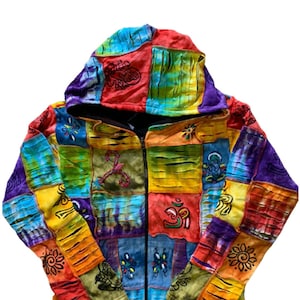 May include: A colourful patchwork hooded jacket with a zip closure. The jacket is made of different fabrics and has a variety of embroidered symbols and designs.