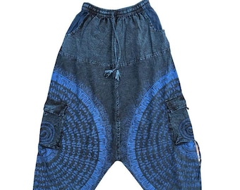 May include: Blue denim pants with a drawstring waist and blue patterned details. The pants have two large cargo pockets on the sides.