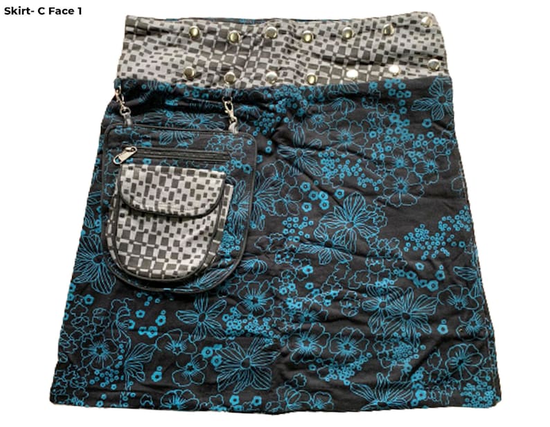 May include: A black skirt with a blue floral print and a checkered pocket. The skirt has a silver studded waistband.