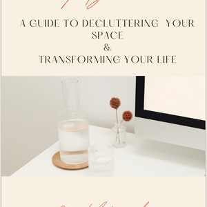 May include: A book cover with the title "Simplify & Thrive: A Guide to Decluttering Your Space & Transforming Your Life" by Crystal Kennedy. The cover features a minimalist design with a clear glass jug and a small vase with dried flowers on a white surface.