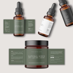 May include: Three natural beauty products: a brown glass bottle of natural oil with a label that says "Natural Oil Mint, Lavender, Almond", a brown glass jar of natural scrub with a label that says "Natural Scrub Mint, Lavender, Pistachio", and a brown glass bottle of oil with a black label.