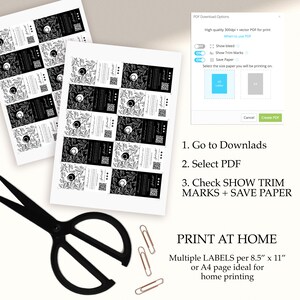 May include: Printable black and white labels with a floral design and a circle in the center. The labels are arranged in a grid pattern on a white background. The image also shows a computer screen with a PDF download options window, scissors, and paper clips.