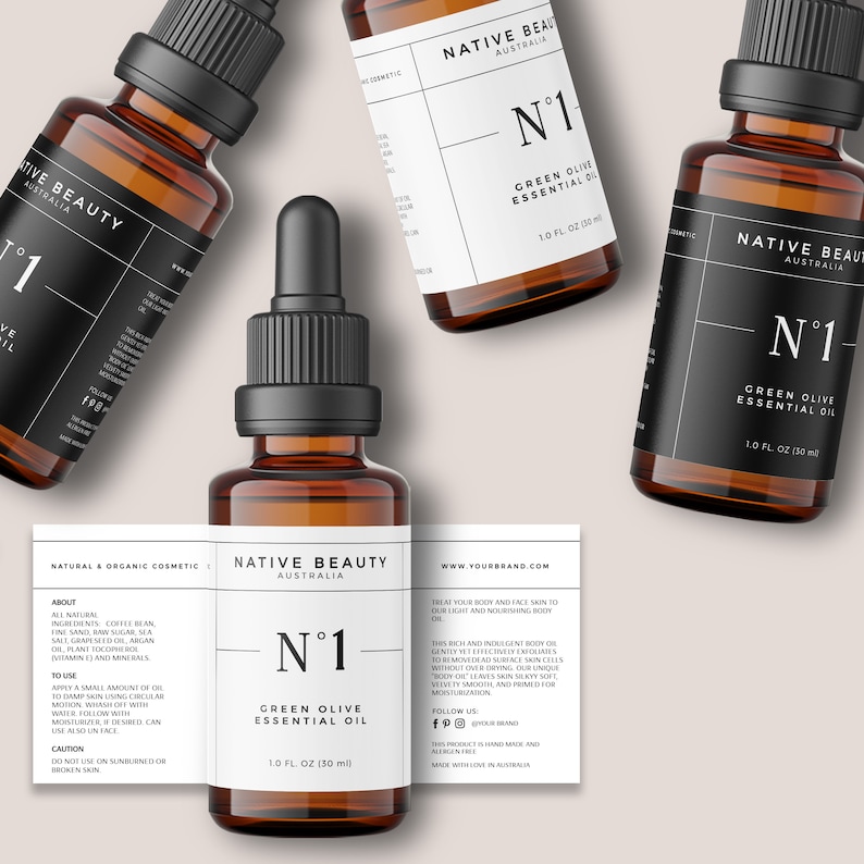K&ouml;nnte beinhalten: Drei bernsteinfarbene Glasflaschen mit schwarzen Tropfern und Etiketten. Die Etiketten sind wei&szlig; mit schwarzem Text und lauten "Native Beauty Australia" und "N&deg;1 Green Olive Essential Oil" mit der Gr&ouml;&szlig;e "1.0 fl oz (30 ml)".