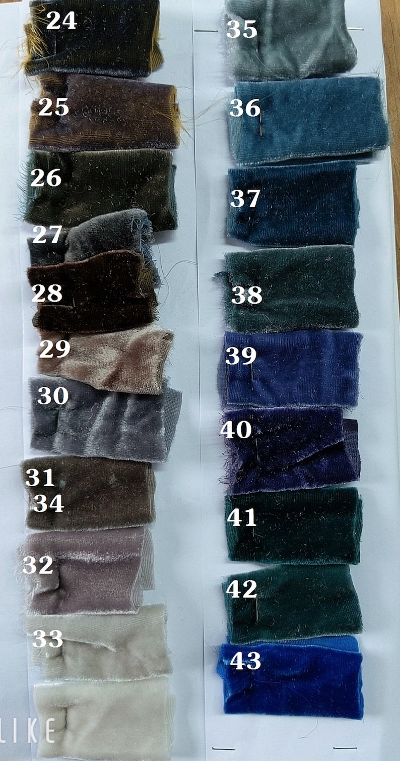 May include: A color chart of fabric swatches, numbered 24 through 43. The swatches are arranged in two columns, with the left column showing shades of brown, gray, and beige, and the right column showing shades of blue and green.