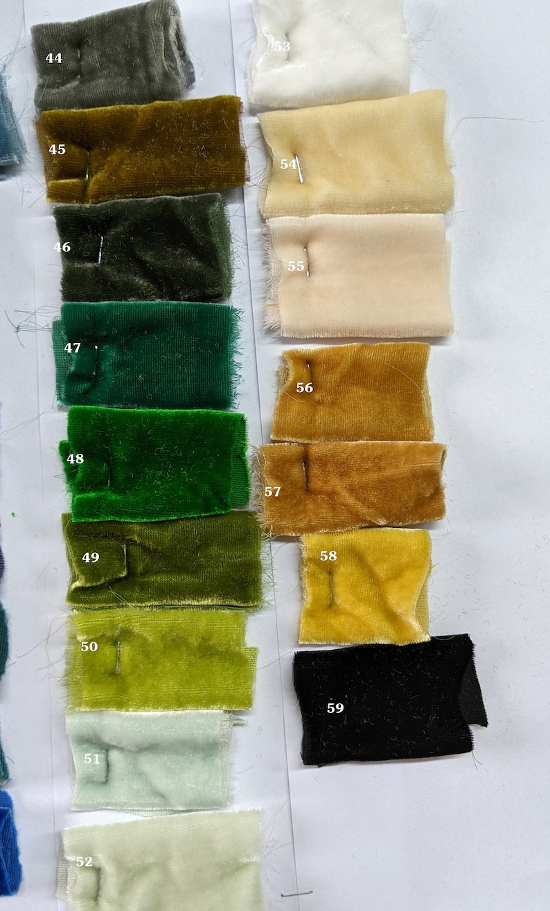 May include: A color chart of fabric swatches, numbered 44 through 59. The swatches are arranged in two columns, with the left column featuring shades of green and the right column featuring shades of yellow, beige, and white. The swatches are all velvet.