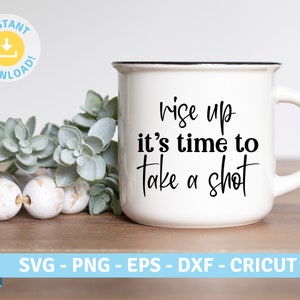 May include: A white ceramic mug with a black rim and handle. The mug features the text "rise up it's time to take a shot" in black script. The image also includes a "Instant Download" graphic and a banner with file type options.