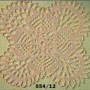 May include: A delicate, off-white crocheted doily with a circular design and intricate lacework. The doily has a center circle and four symmetrical sections with a floral pattern. The doily is labeled "554/12".