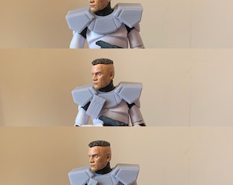 May include: A white and gray action figure of a soldier wearing a helmet and armor. The figure has a short haircut and a serious expression.