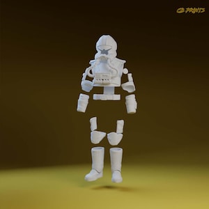 Puede incluir: Un traje espacial blanco desmontado, que incluye un casco, un peto, componentes de brazos y piernas y botas. El traje tiene un diseño detallado con tubos y paneles. El texto "CD PRINTS" está en la esquina superior derecha.