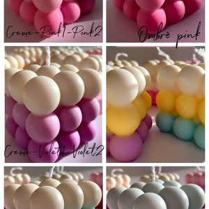 May include: Four different color variations of a bubble candle. The candle is made of multiple spheres in a cube shape. The colors are creme, pink, violet, and aqua.