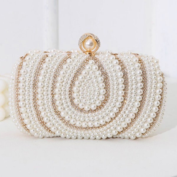 Pearl ivory clutch bag detailed with gold