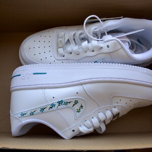 Side view of personalized Nike Air Force 1 shoes with hand-painted blue forget-me-not flowers, ideal for gifting or everyday wear.