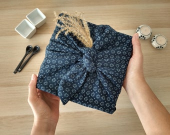 Furoshiki, reusable gift wrap in blue fabric, Japanese minimalist style