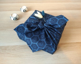 Furoshiki, eco-friendly gift wrapping in blue-gray and black fabric