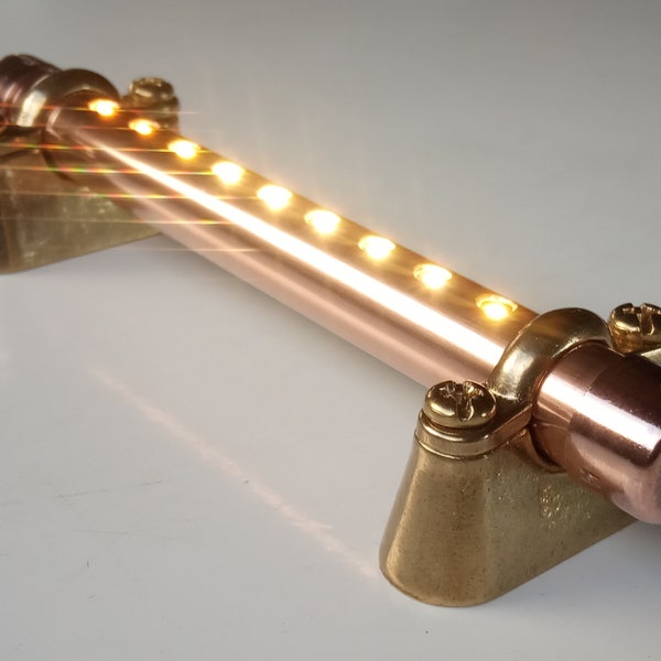 Copper pipe 12V / Mains led light with switch. Supplied with brass mounting brackets. Home, campervan, motorhome, boat, reading light.