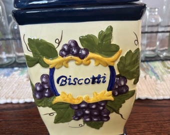 Barattolo per biscotti Nonni's con coperchio, forma quadrata, in ceramica, con motivo frutta e uva.