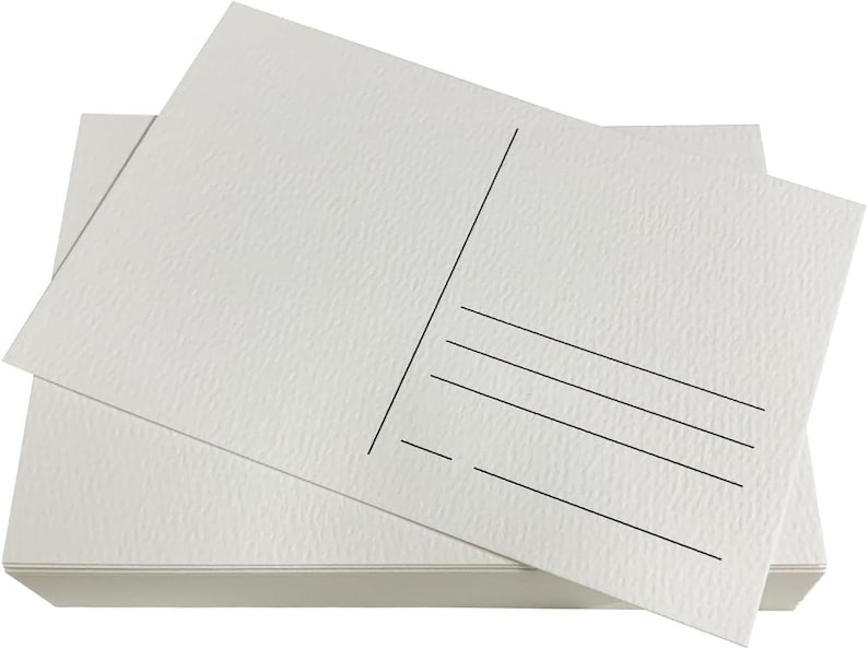 May include: A stack of blank white postcards with a textured surface. The postcards have a space for an address and a message on the back.