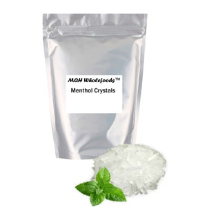 May include: A silver resealable bag labelled "MQH Wholefoods™ Menthol Crystals" with a pile of clear, white menthol crystals and a sprig of green mint leaves.