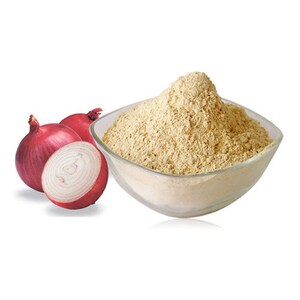 May include: A white bowl filled with light brown onion powder, next to two whole red onions and a sliced red onion.