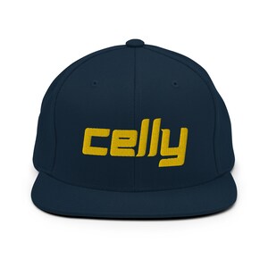 May include: A navy blue baseball cap with a yellow embroidered logo that says "celly".