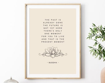 May include: A beige framed print with a black and white illustration of a lotus flower. The print features a quote by Buddha: "The past is already gone. The future is not yet here. There's only one moment for you to live and that is the present moment."