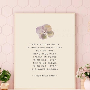 May include: A beige poster with a quote by Thich Nhat Hanh. The quote reads: "The mind can go in a thousand directions but on this beautiful path I walk in peace with each step the wind blows with each step a flower blooms." The poster features a pressed flower in the top right corner.