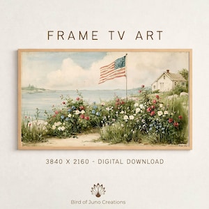 May include: A framed digital art print featuring a watercolor painting of an American flag waving near a white house by the sea. The artwork includes colorful flowers and the text "FRAME TV ART".