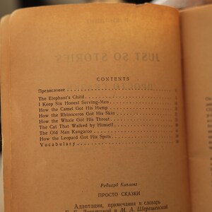 May include: A vintage book with a tan cover and a table of contents listing "The Elephant's Child", "I Keep Six Honest Serving-Men", "How the Camel Got His Hump", "How the Rhinoceros Got His Skin", "How the Whale Got His Throat", "The Cat That Walked by Himself", "The Old Man Kangaroo", "How the Leopard Got His Spots", and "Vocabulary".