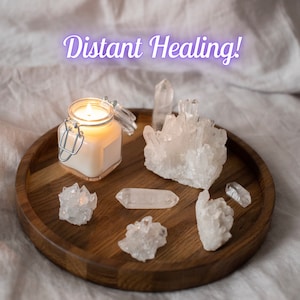 May include: A wooden tray with a lit candle and several clear quartz crystals. The text "Distant Healing!" is written in purple letters above the tray.