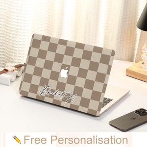 May include: A brown and beige checkered laptop skin with a white Apple logo and the name "Rachel H" written in black cursive.